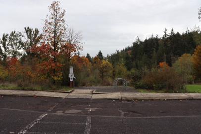 Sunnyside Road trailhead – curb cut – bike racks – park rules – starts with wide compacted crushed rock trail surface